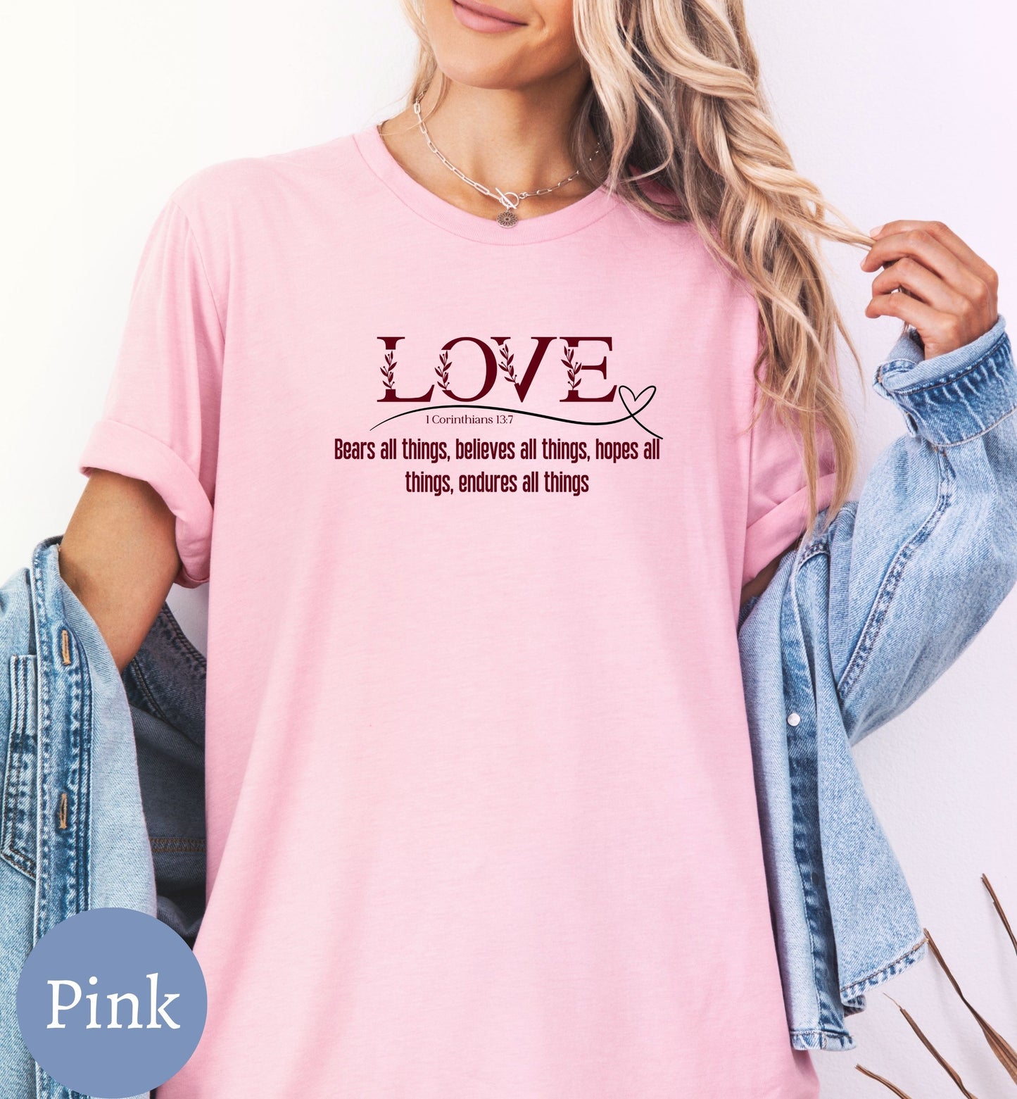 a woman wearing a pink shirt that says love