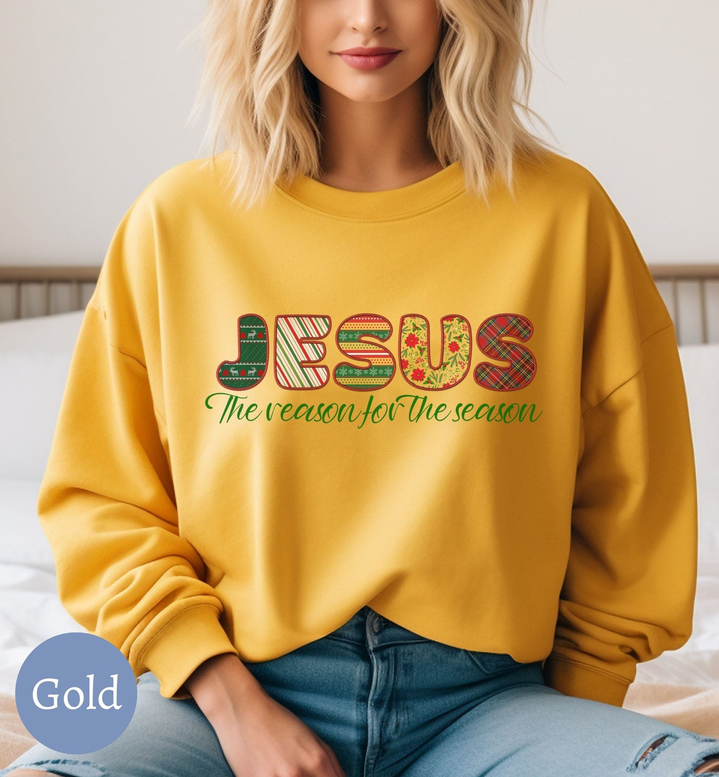 a woman sitting on a bed wearing a yellow sweatshirt