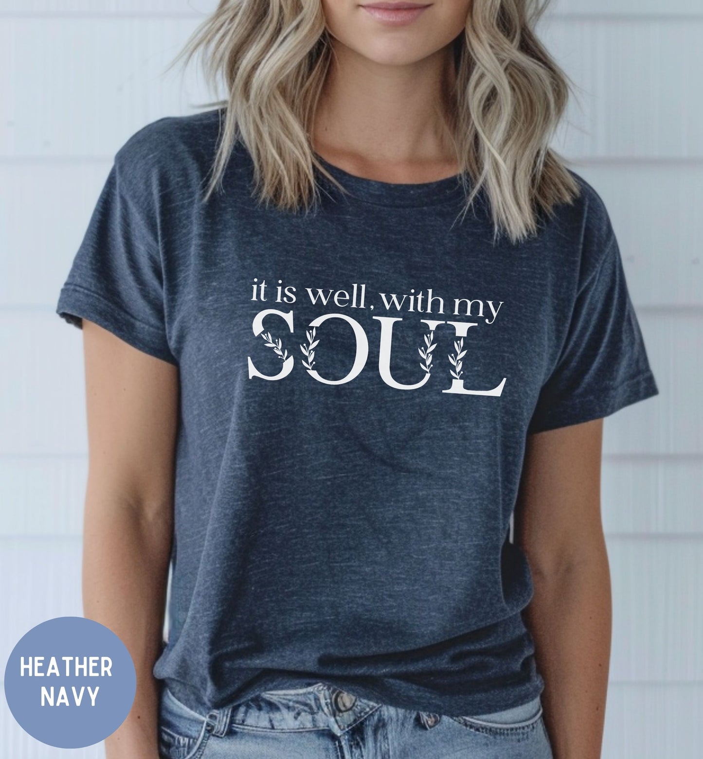 a woman wearing a t - shirt that says it's well with my soul