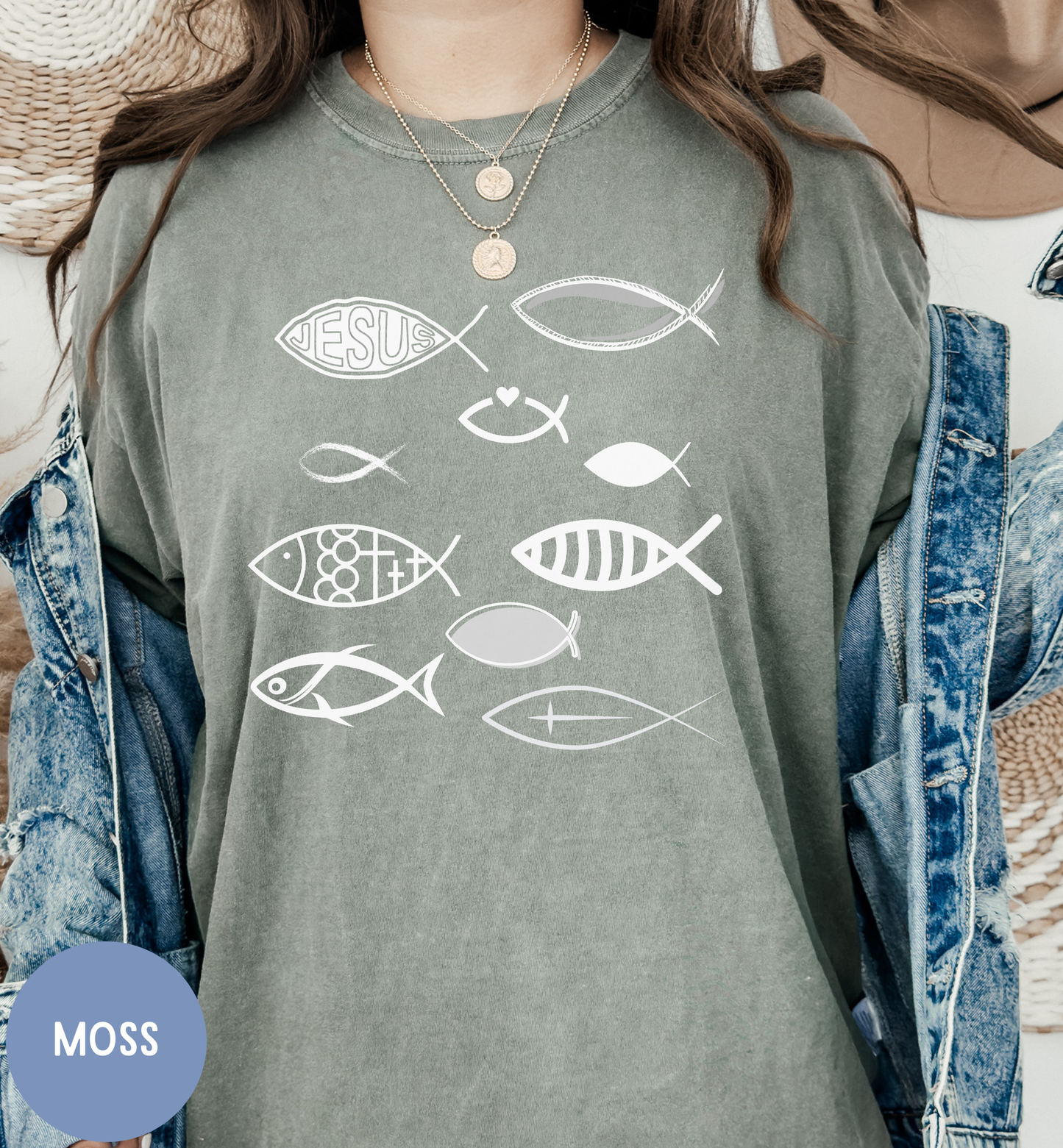 a woman wearing a green shirt with fish on it