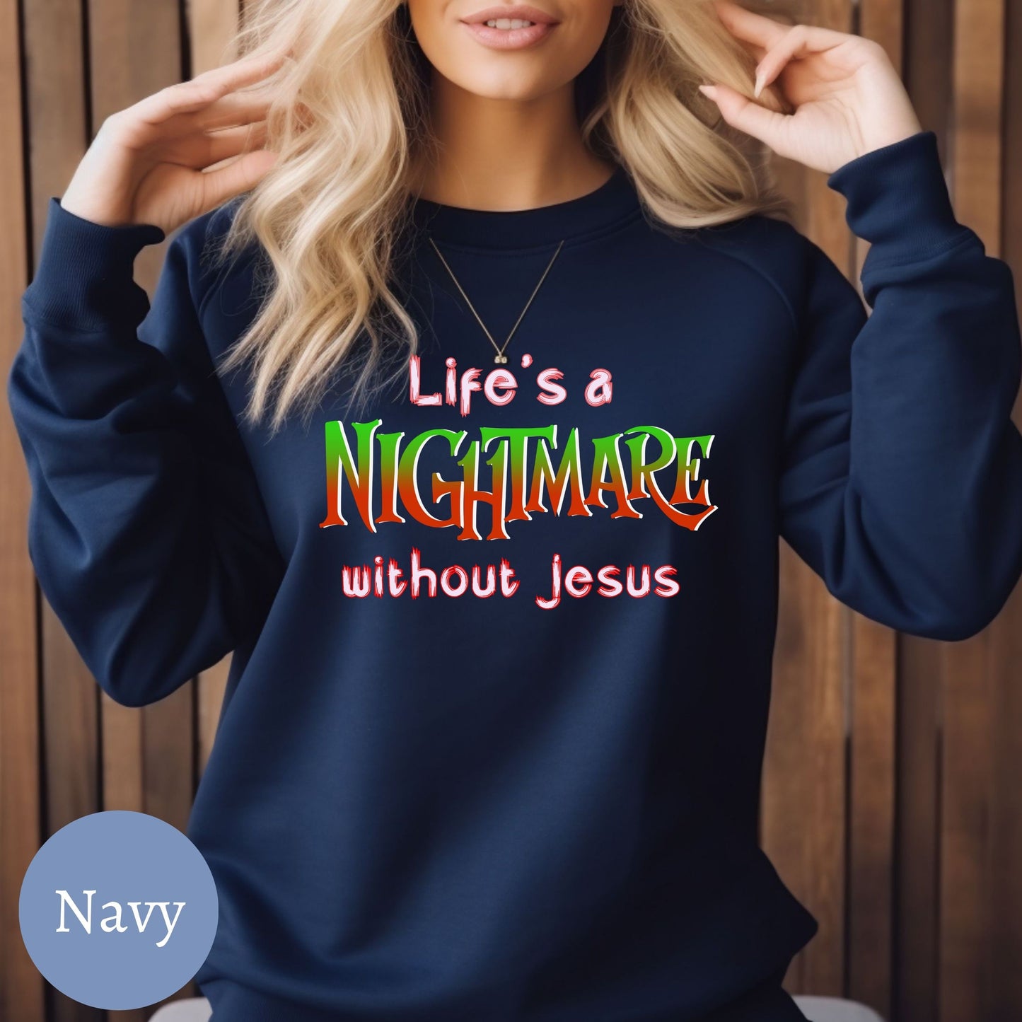 a woman wearing a sweatshirt that says life's a nightmares without jesus