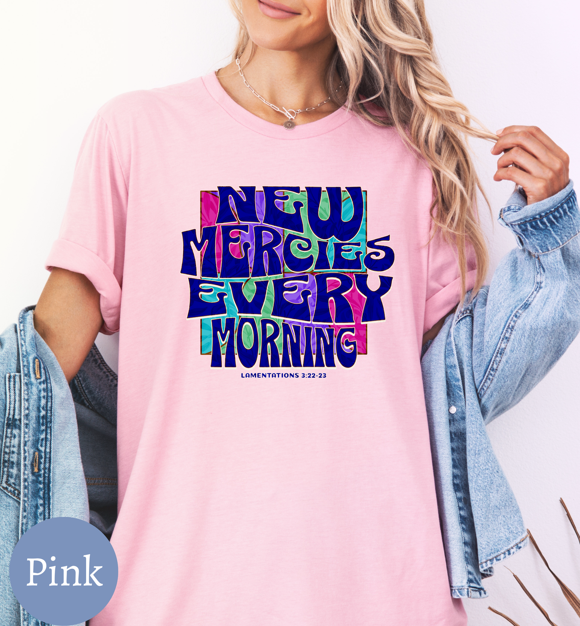 a woman wearing a pink shirt that says neu merries every morning