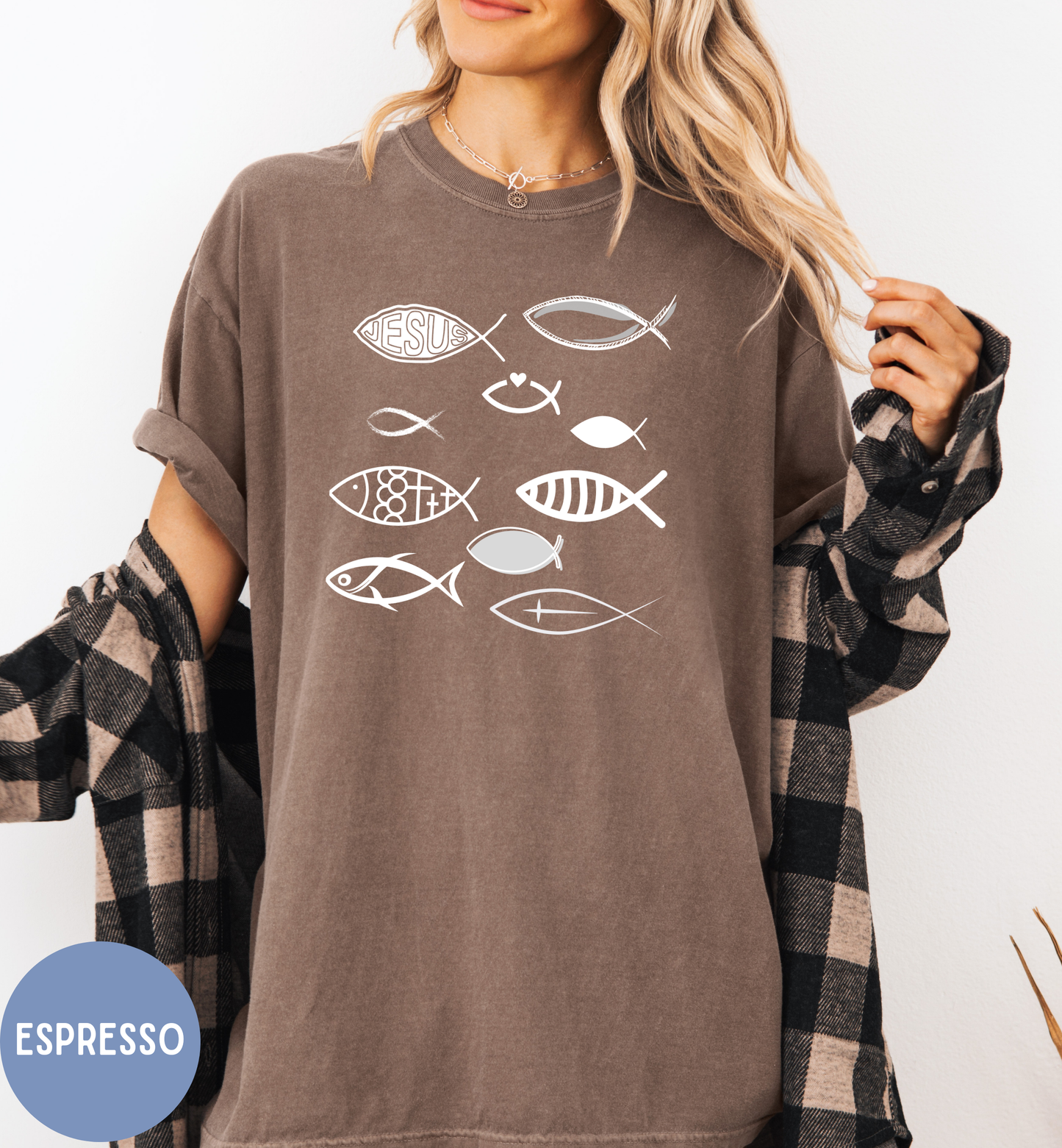 a woman wearing a brown shirt with fish on it