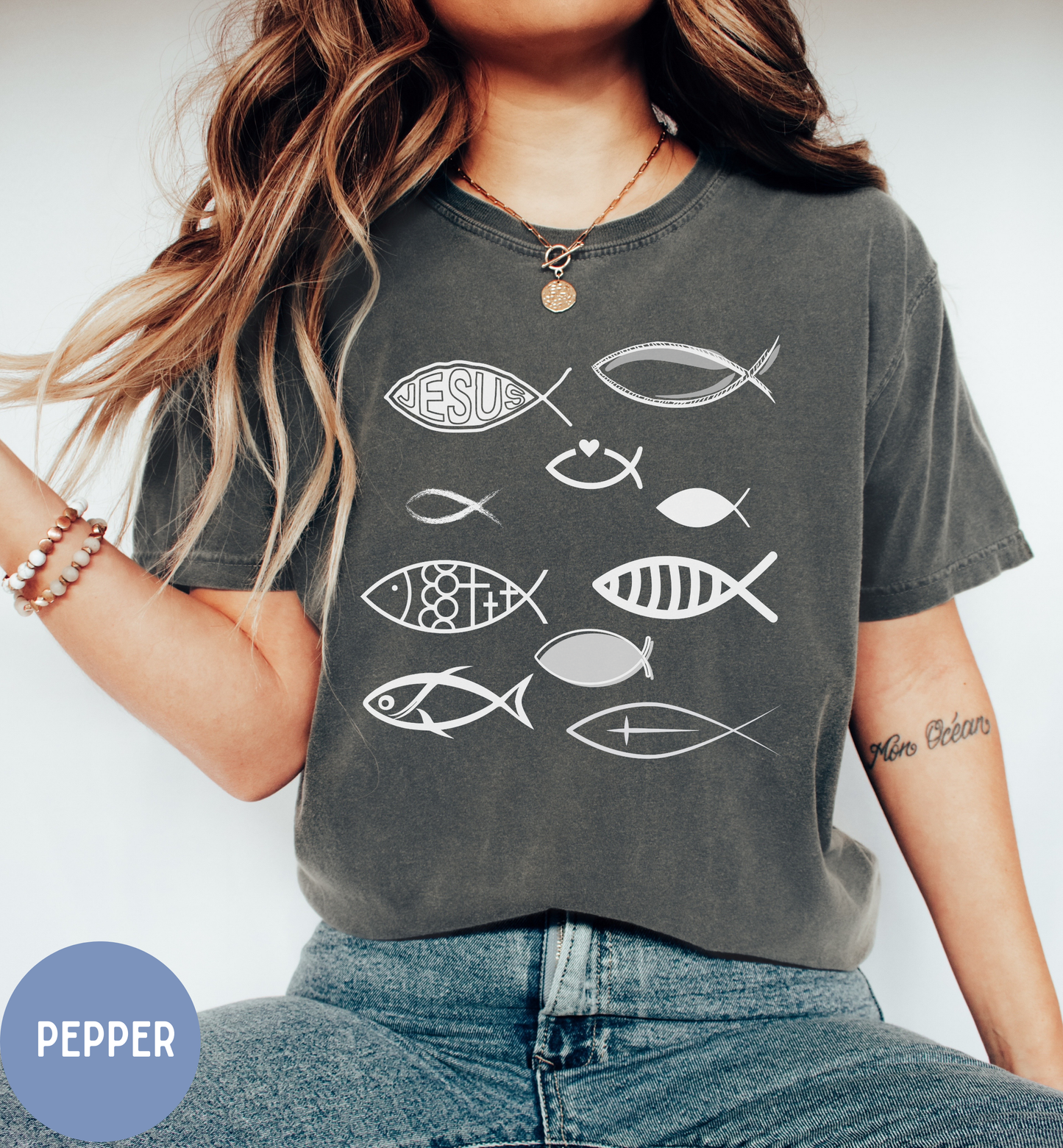 a woman wearing a t - shirt with fish on it