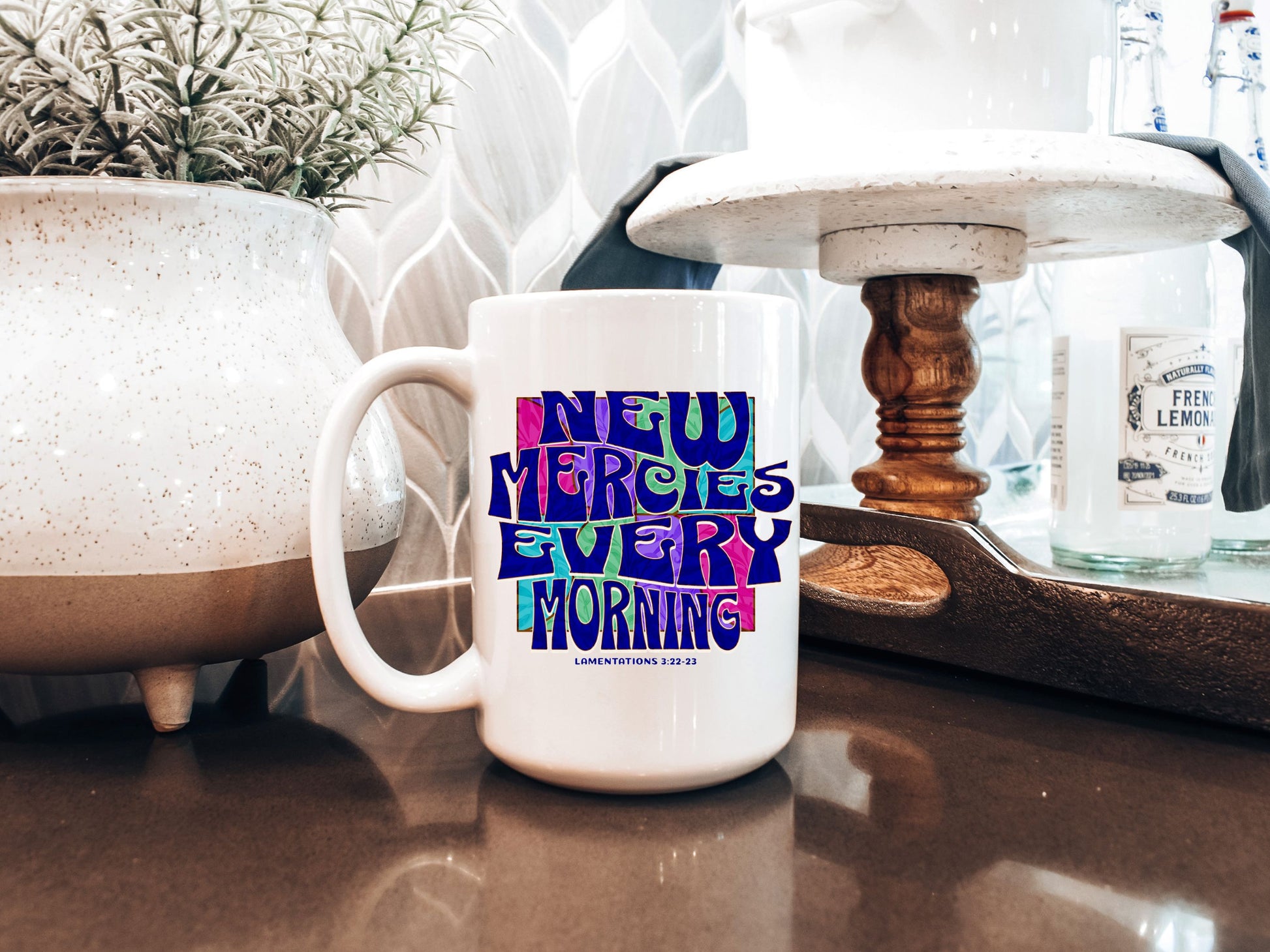 a white coffee mug sitting on top of a counter