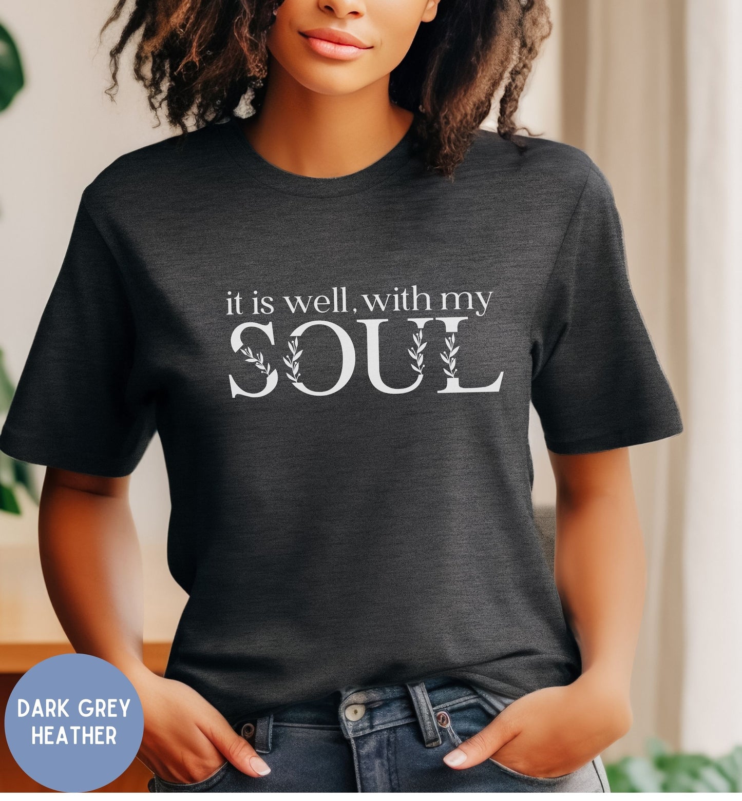 a woman wearing a t - shirt that says it is well with my soul