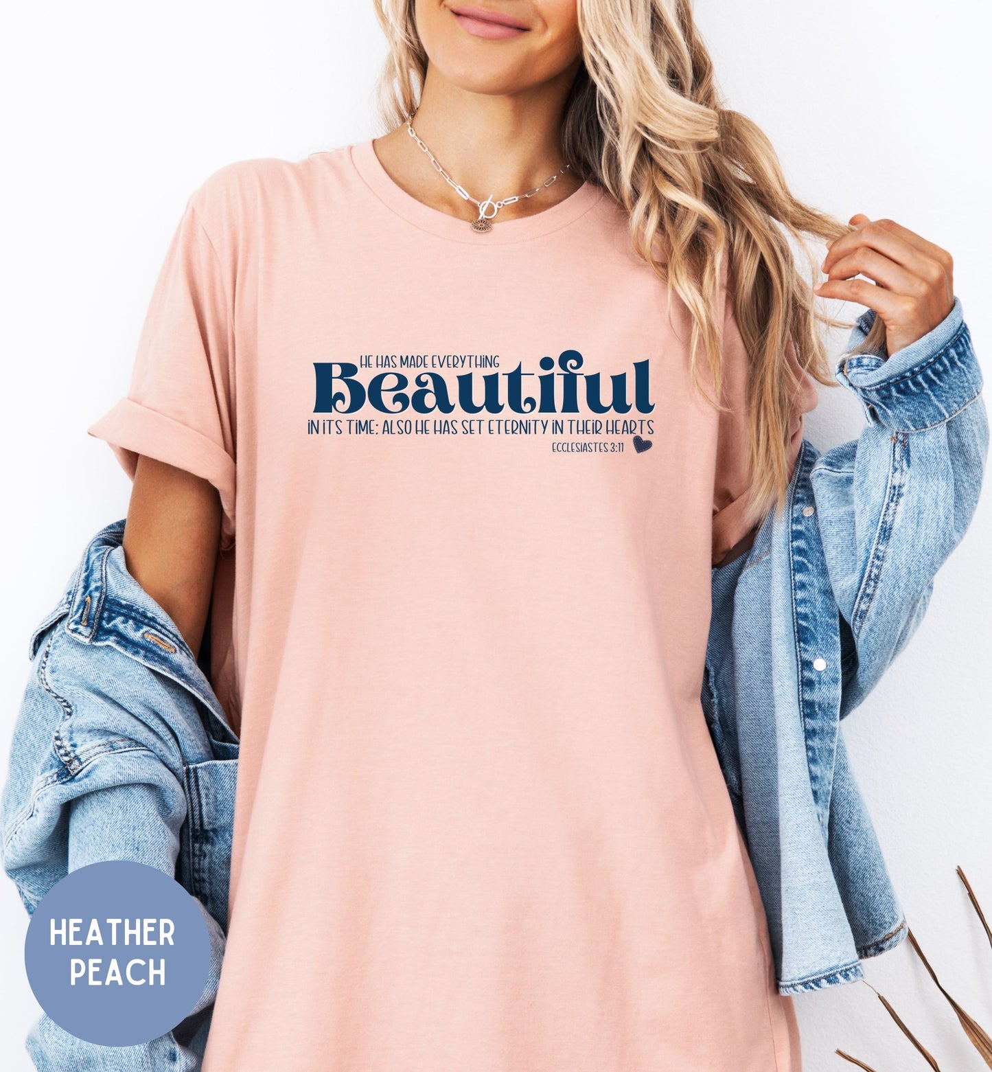 a woman wearing a pink t - shirt with the words beautiful printed on it