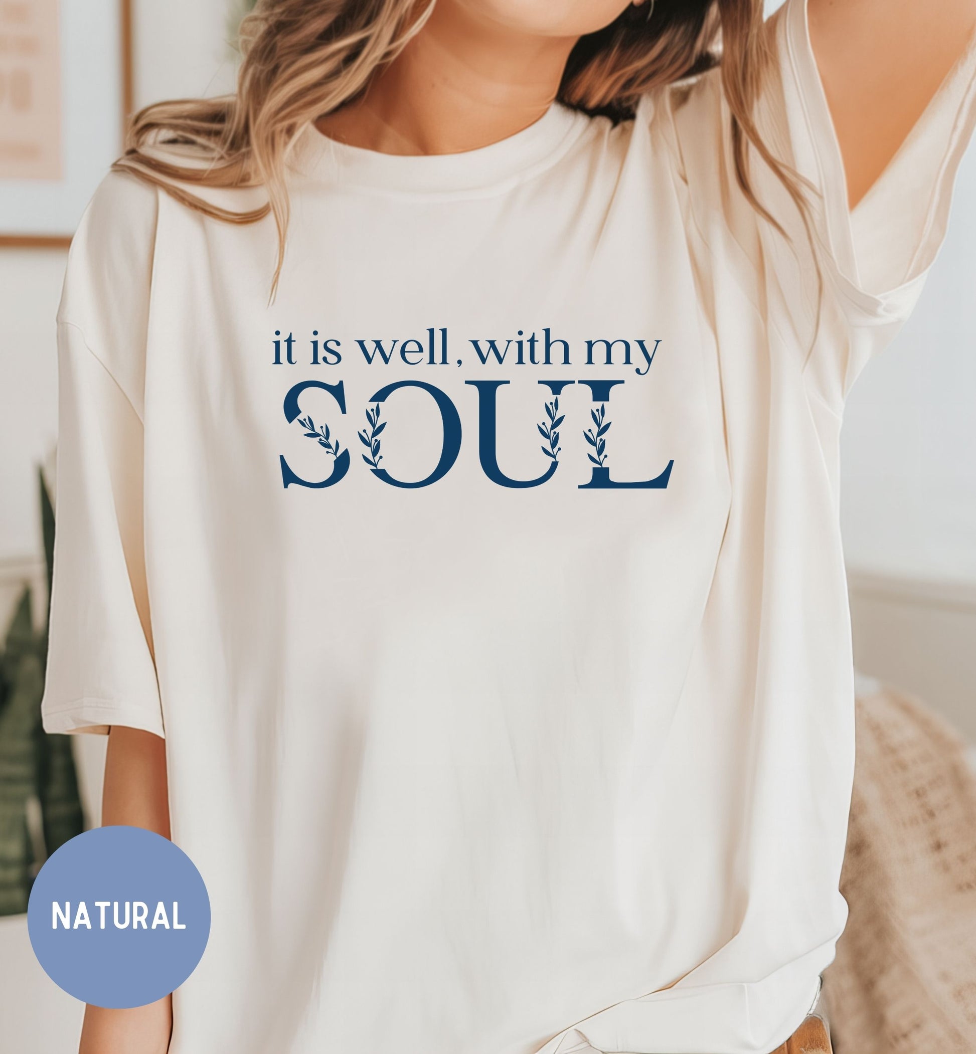 a woman wearing a t - shirt that says it is well with my soul