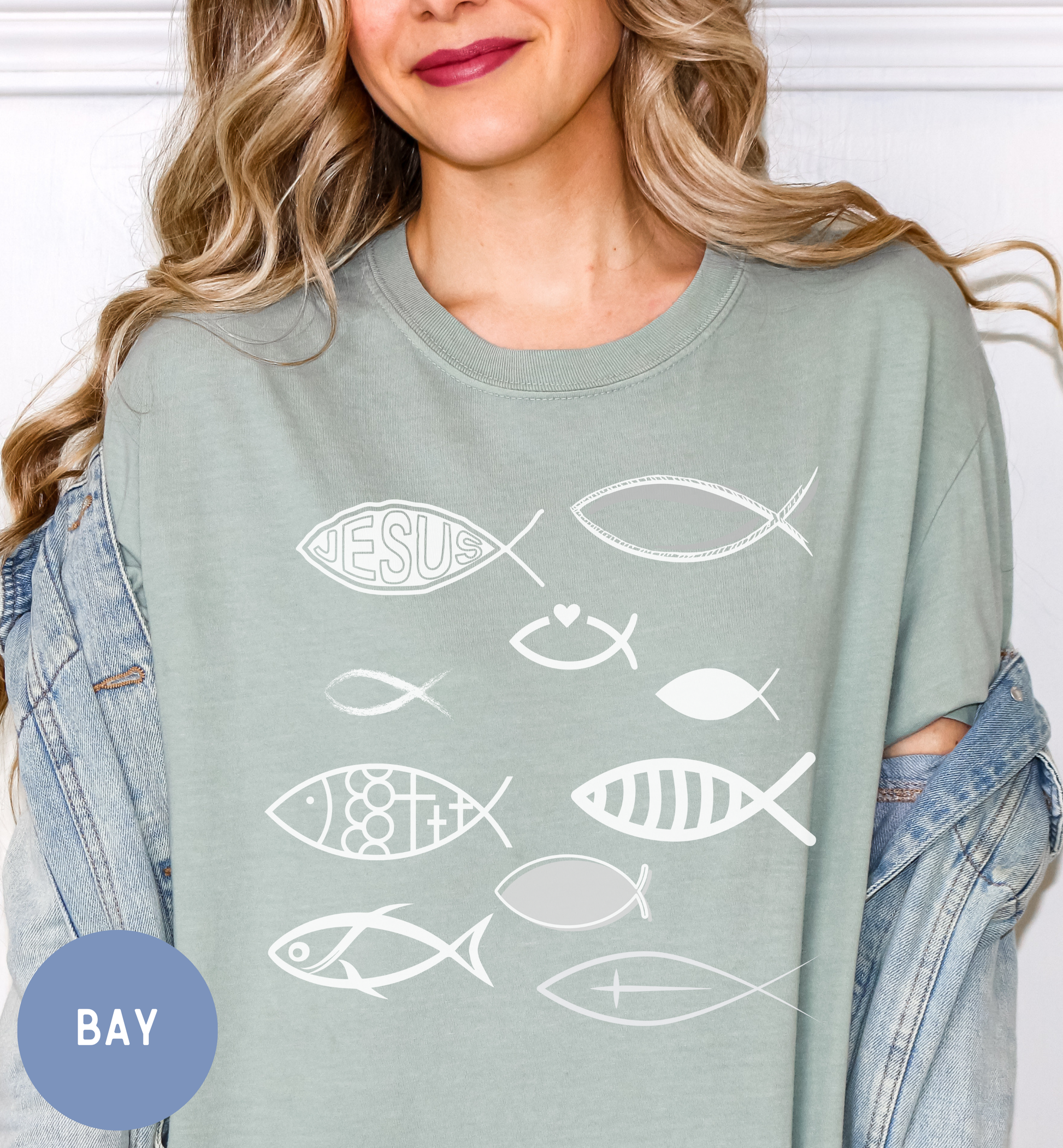 a woman wearing a t - shirt with fish on it