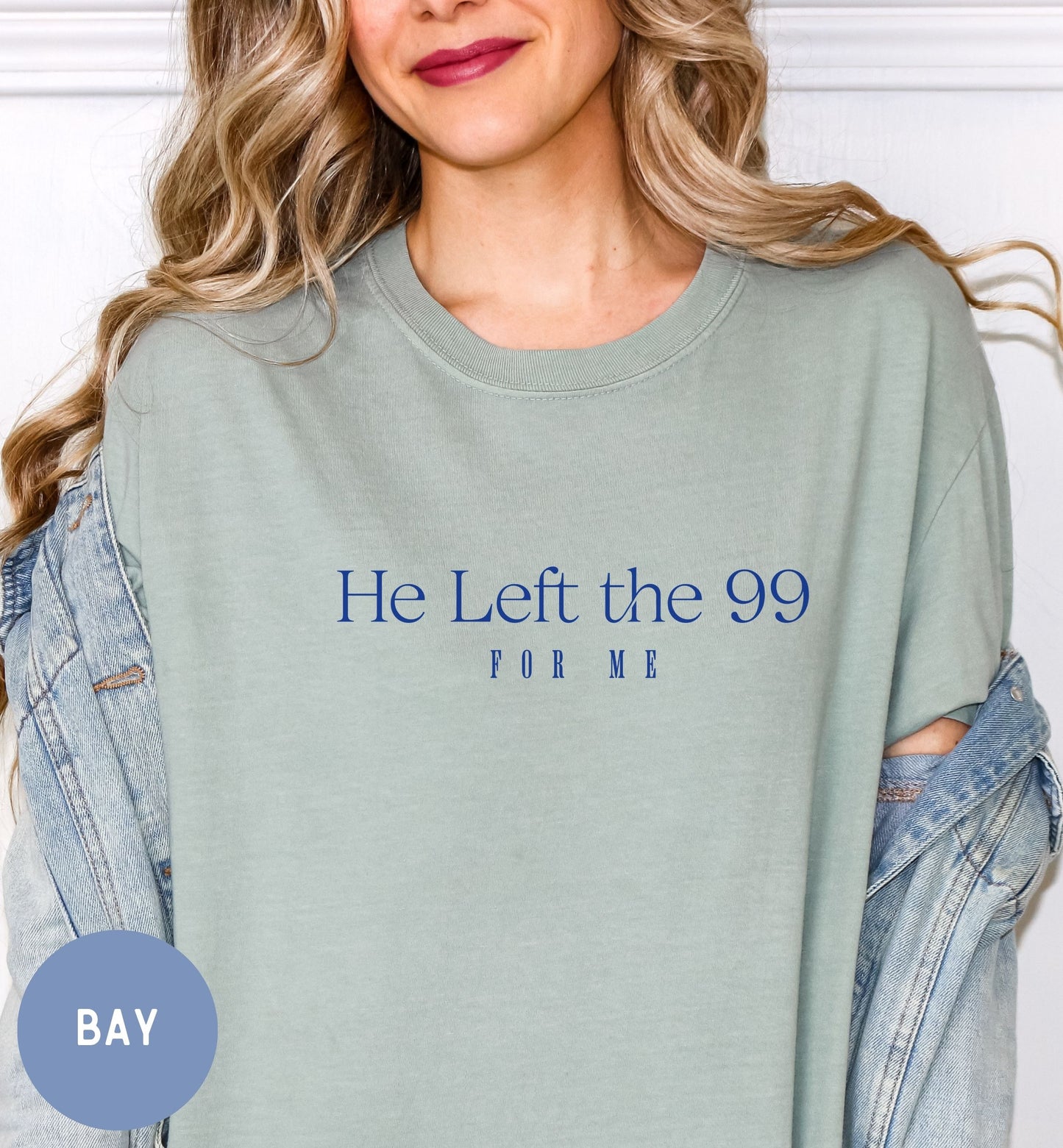 a woman wearing a t - shirt that says he left the 99 for me