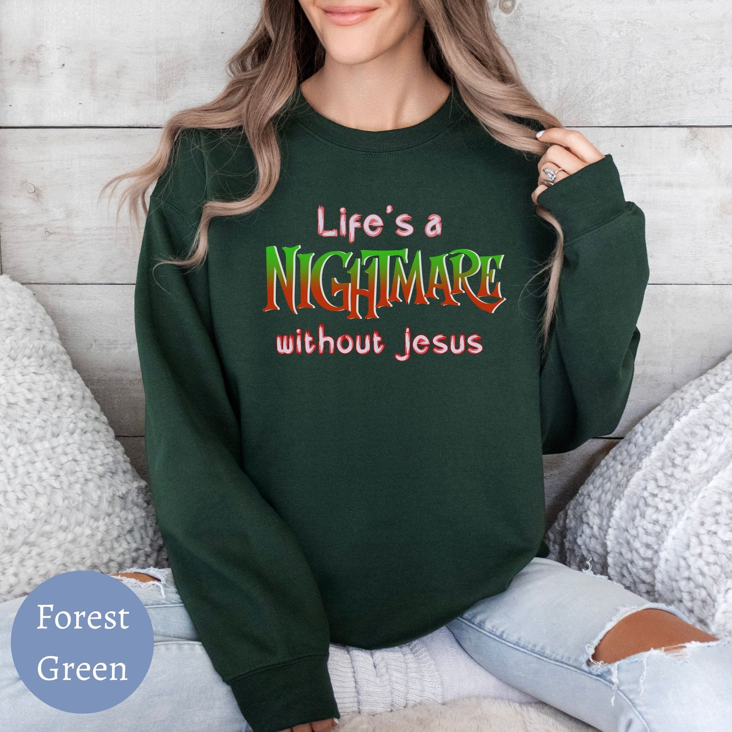 a woman wearing a green sweatshirt that says life's a nightmares without jesus