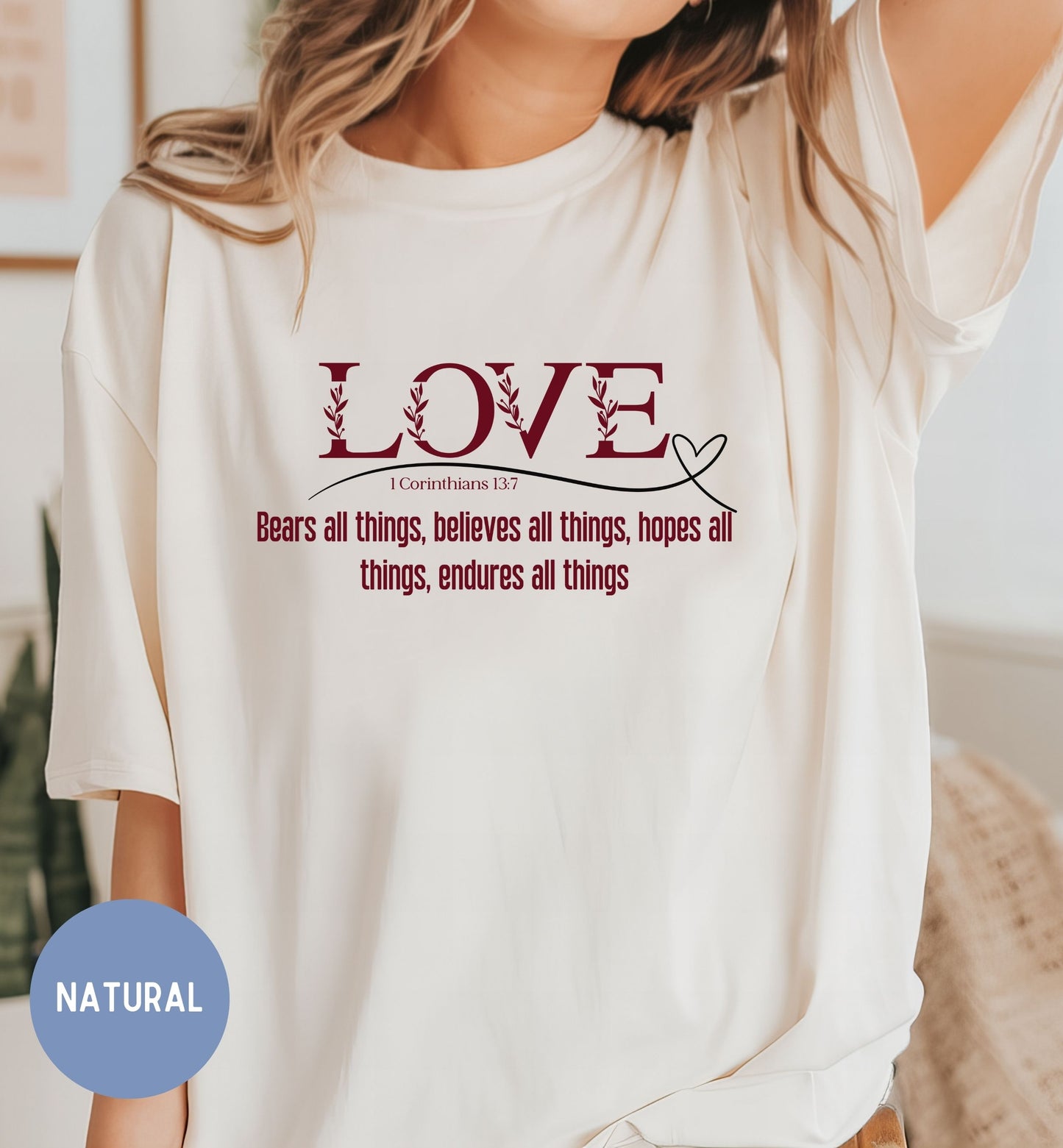 a woman wearing a t - shirt that says love bears all things, achieve all